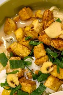 Fried tofu cubes float in creamy broth Stock Photos