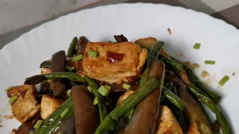 Fried Tofu with Mixed Vegetables Plating Stock Footage 234882104