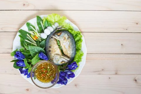 Fried two mackerels with vegetable on white Stock Photos