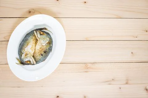 Fried two mackerels with white dish Stock Photos