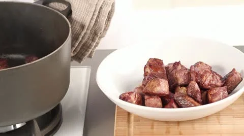 Fried veal being removed from a pot Stock Footage 24658258
