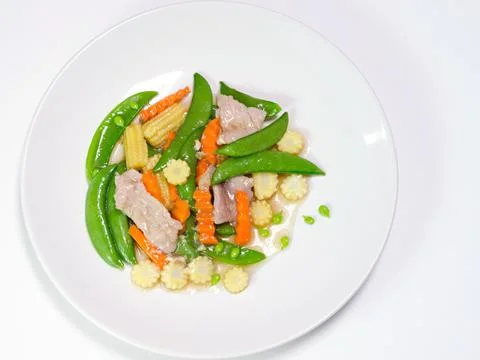 Fried vegetable on white dish closeup Stock Photos