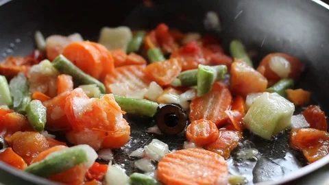 Fried vegetables in a frying pan Video stock 78479779