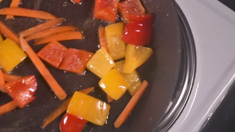Fried vegetables in a pan Stock Footage 157536456
