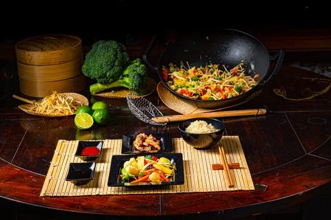 Fried vegetables from the wok with deep fried meat Stock Photos