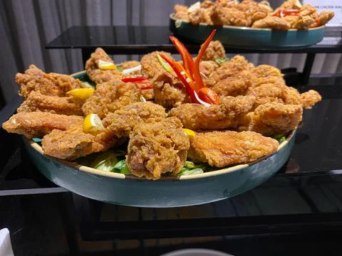 Fried wing chicken served on the table of hotel or restaurant. Buffet menu Stock Photos
