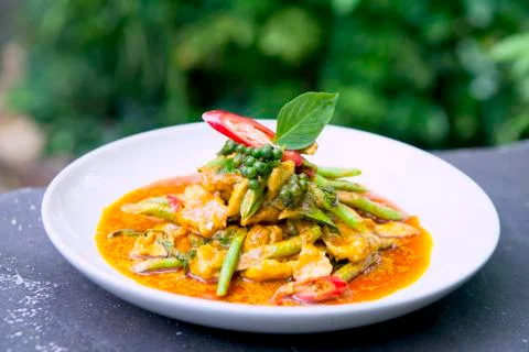 Fried Yard Long bean with red curry paste and pork Stock Photos