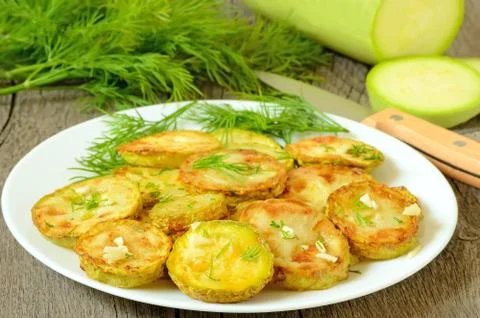 Fried zucchini with dill Stock Photos