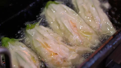 Fried Zucchini Flowers Sizzling to Perfection Stock Footage 264908853
