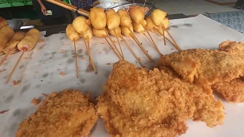 Friedrying chicken legs in a pan close up Stock Footage 176467204