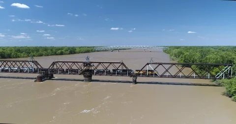 Frieght train going over large bridge and river drone aerial 4K Stock Footage 111364016