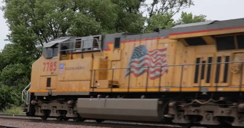 Frieght Train Passing with Large Tree Video stock 91957966