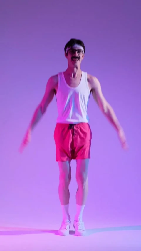 Friendly 90s Man Doing Burpee Exercise And Training Muscles On Purple Background Stock Footage 287319569