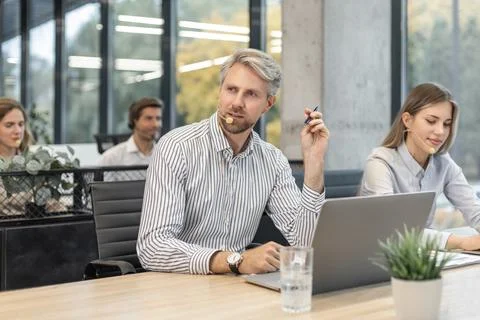 Friendly and helpful customer service support specialists in work Stock Photos