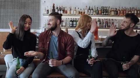 Friendly atmosphere among friends. Drinking beer, cheering for favourite team in Stock Footage 106093810