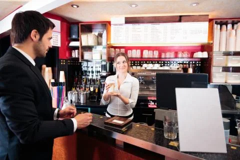 Friendly Bartender At A Cafe Фото