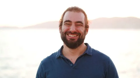 Friendly bearded man turns to camera and send a kiss to it 스톡 동영상 160149356