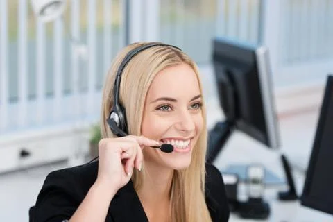 Friendly call centre operator or receptionist Stock Photos