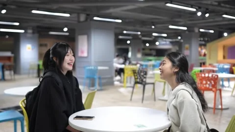 Friendly Chat in University Cafeteria in Da’an District, Taipei Stockbeeldmateriaal 281080773