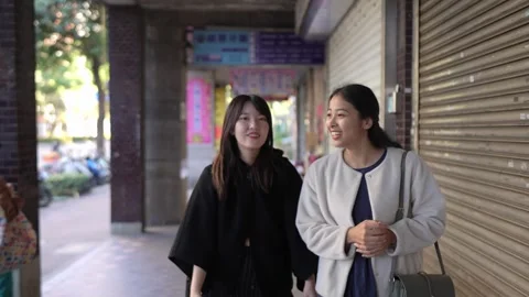 Friendly Chat While Walking on Street Near University in Da’an District, Taipei Stock Footage 281081104