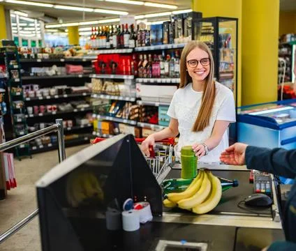 Friendly checkout experience at a vibrant grocery store Stock Photos