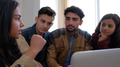 Friendly colleagues discuss their strategy and game plan while their boss is in  Stock Footage 101188800