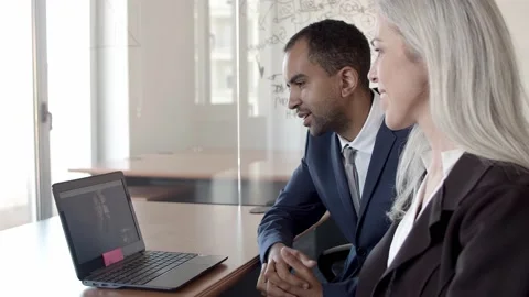 Friendly colleagues talking via video call Stock-Footage 137510251