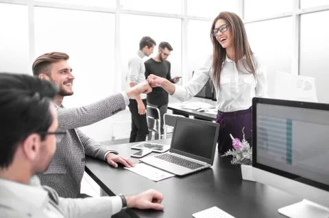 Friendly colleagues in the workplace. Stock Photos
