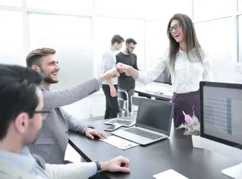 Friendly colleagues in the workplace. Stock Photos