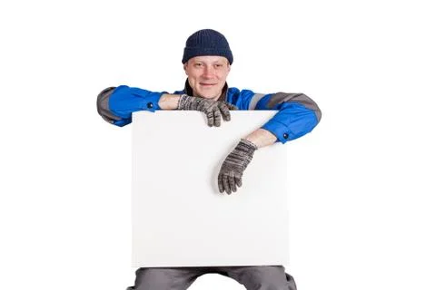 Friendly construction worker holding a blank, white sign. Isolated on white Stock Photos