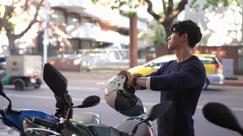 Friendly Conversation Before Riding: Young Man at Taipei University Видео 281963369