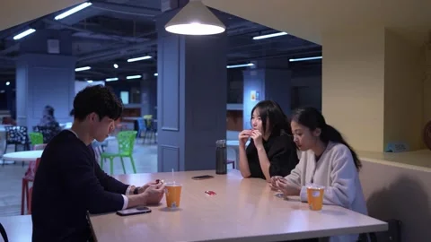 Friendly Conversation at University Cafeteria in Da’an District, Taipei 動画素材 281078404