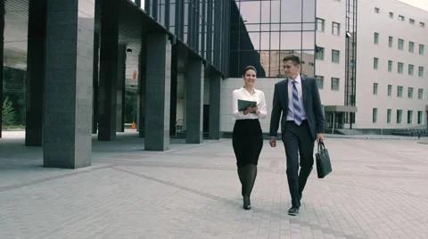 Friendly coworkers are going to an important meeting in office center Stockbeeldmateriaal 68036665