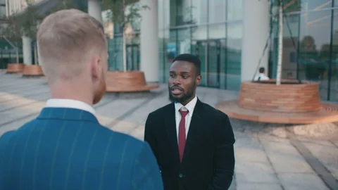 Friendly creative diverse colleagues discuss project doing handshake standing Stock Footage 118075014