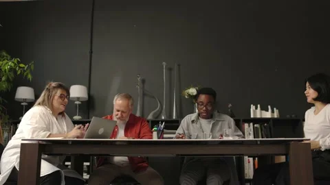 Friendly creative diverse colleagues team discuss future projects at workplace. Stock Footage 166060492
