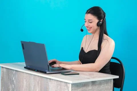 Friendly Customer Service Representative Working on Laptop Stock Photos