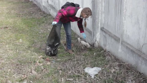 Friendly ecologists cleaning the garbage at park Stock Footage 119905735