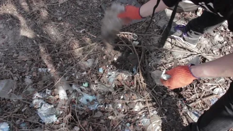 Friendly ecologists cleaning the garbage at park Stock Footage 119919804