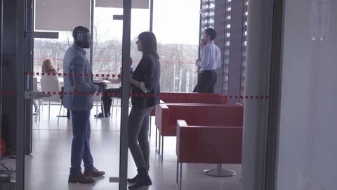 Friendly employees chilling in the modern office breakout space Stock-Footage 74284498