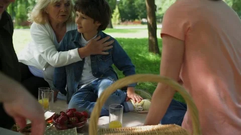Friendly familing having a picnic in the park Stock Footage