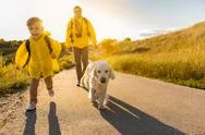 Friendly Family Traveling In Nature With Pet Stock Photos