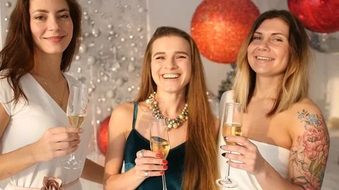 Friendly friends stand drinking champagne and laughing on a festive evening. HD Stock Footage 93172003