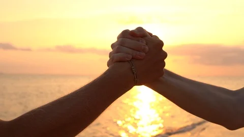 Friendly handshake two men on sea water background in sunset on tropical beach Stock Footage 101313150