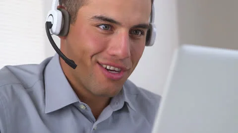 Friendly Hispanic telemarketer working at computer Stock Footage 26181870
