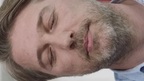 Friendly looking male looking left and right at camera. Stock Footage 196112901