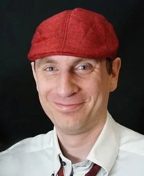 Friendly looking man with red cap Stock Photos