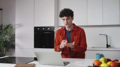 Friendly male freelancer having video call on laptop, discussing work project Stock Footage 337907123