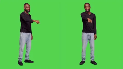 Friendly male model waving at someone on camera Stock Footage 238891229