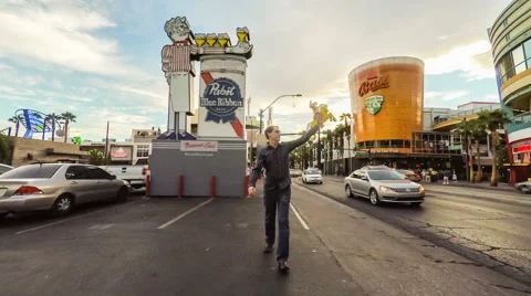 Friendly man walking forward in a backwards world Stock Footage 68799224