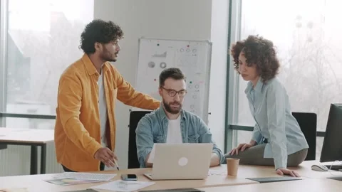 Friendly multiethnic team of startup employees in the office or coworking are Stock Footage 240407115